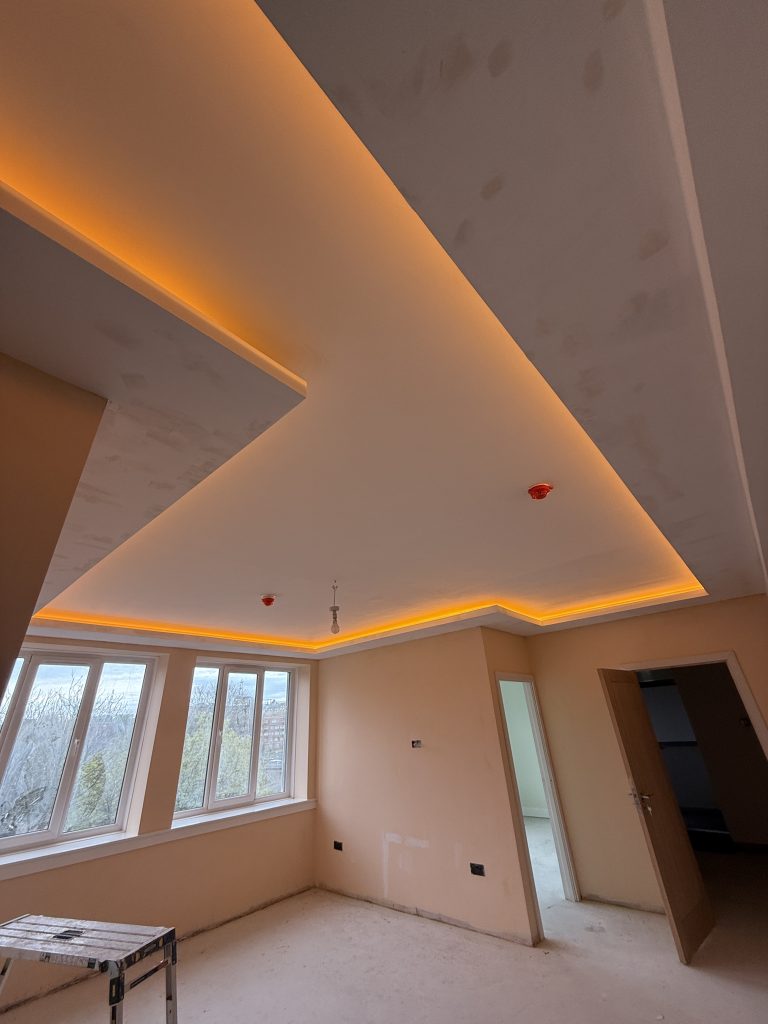 Modern living room ceiling in Giffnock, Glasgow by AMR Builders.